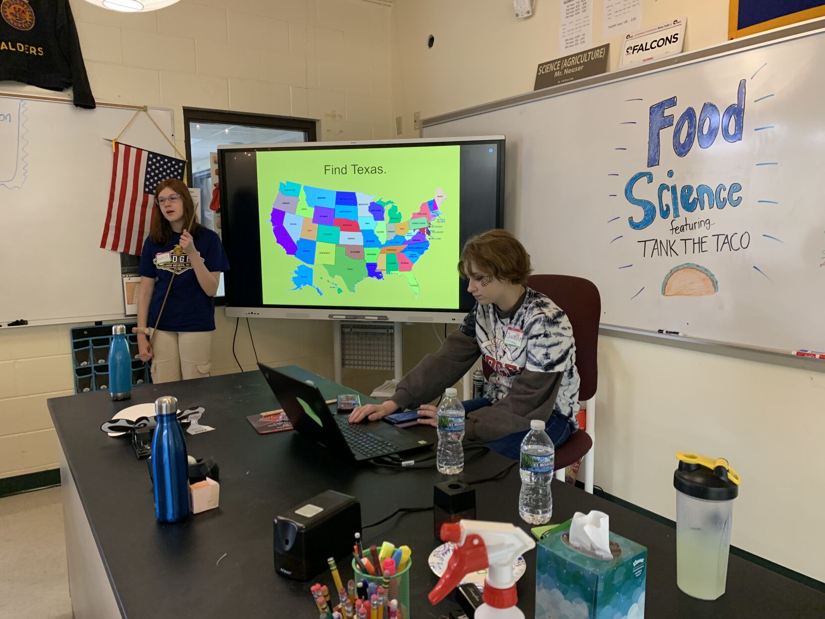 Badger High School agriculture students talk with third graders about where different ingredients for tacos are produced in the United States.
